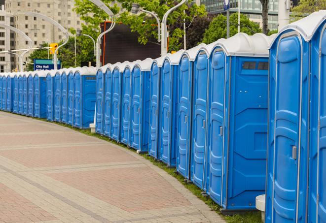 a row of sleek and modern portable restrooms at a special outdoor event in Bloomfield